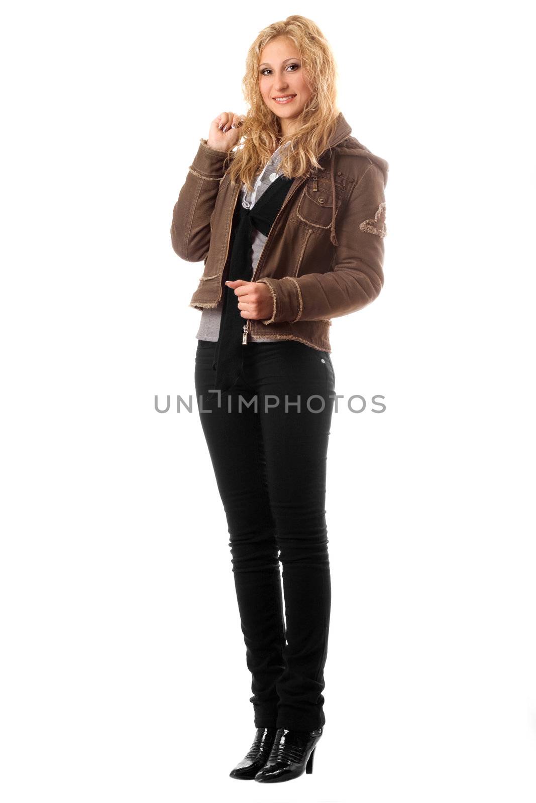 Smiling young blonde in a black pants. Isolated