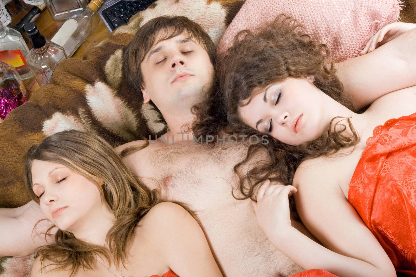 Sleeping young man and two women after a party by acidgrey