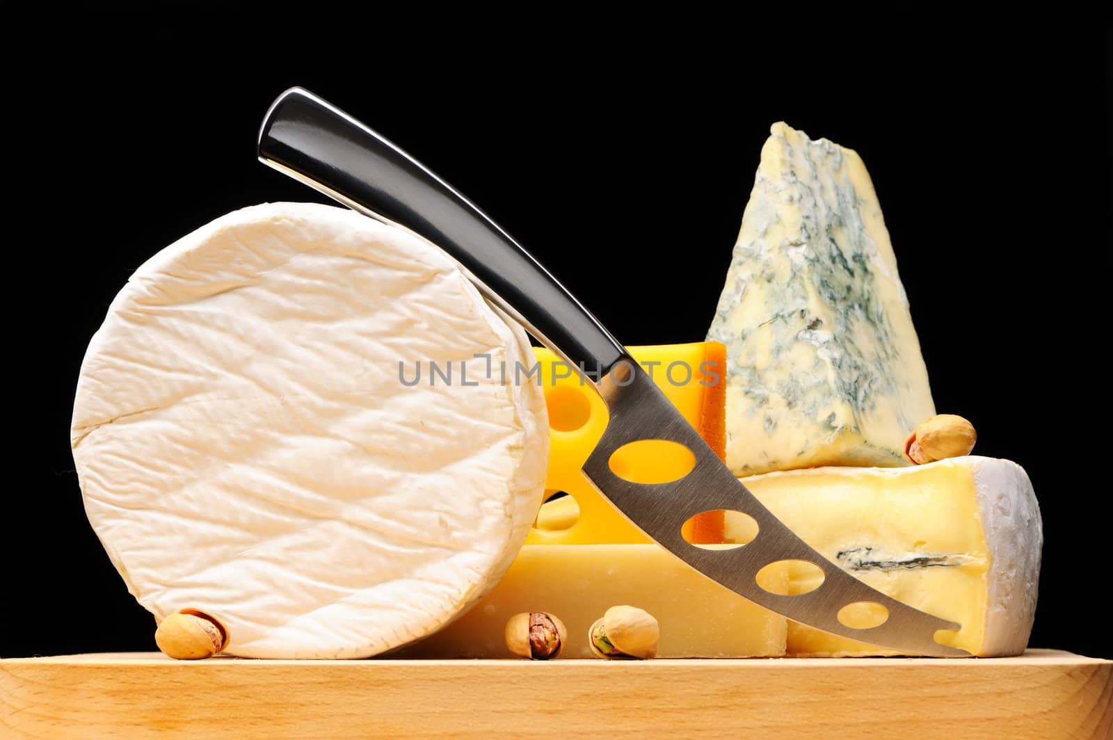 Various types of cheese over black 