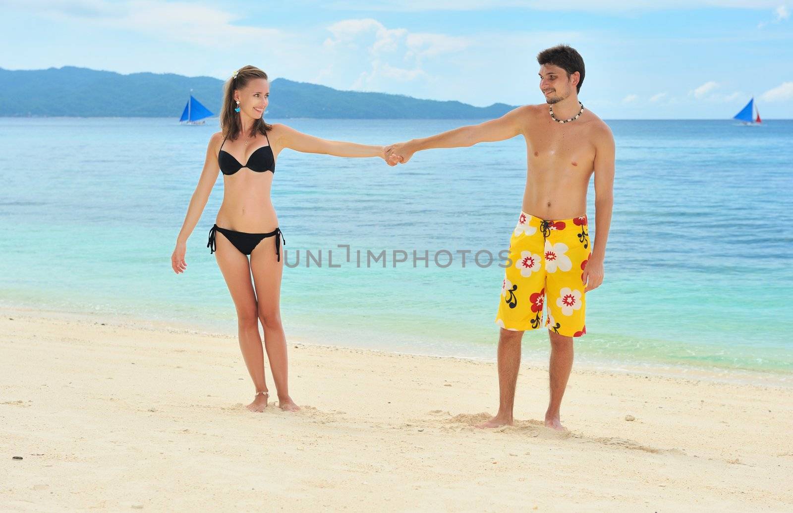 Beautiful couple on a tropical beach