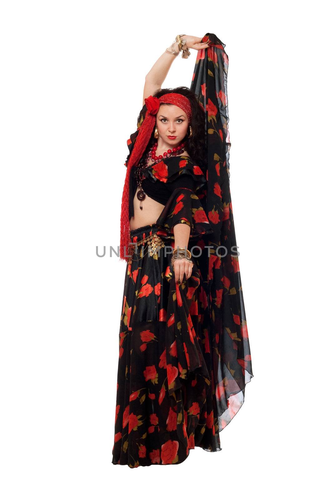 Expressive gypsy woman in a black skirt. Isolated
