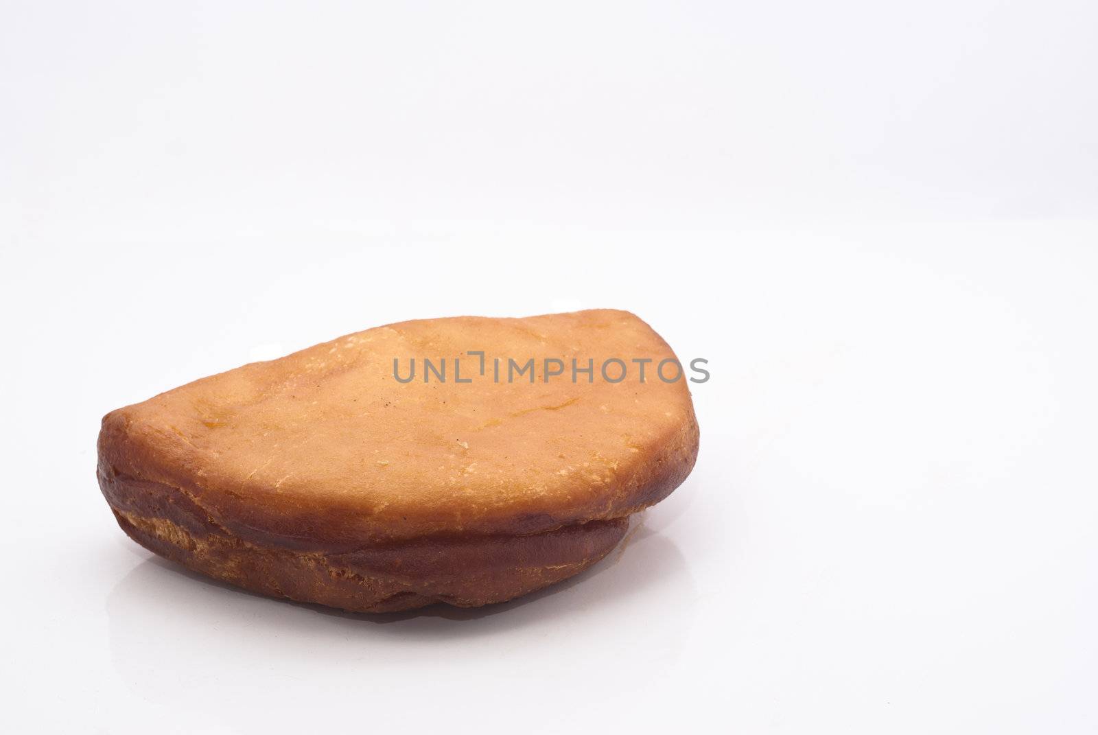 Sicilian rotisserie. Fried calzone with mozzarella and ham isolated on white.