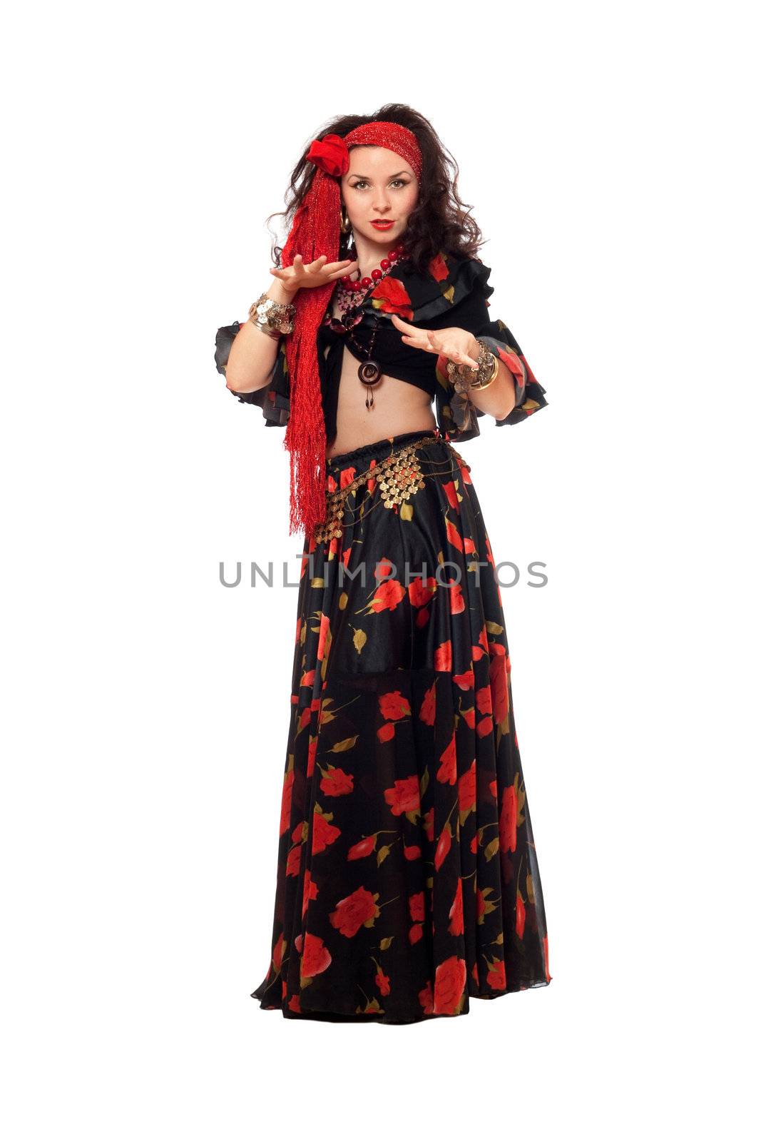 Sensual gypsy woman in a black skirt. Isolated on white
