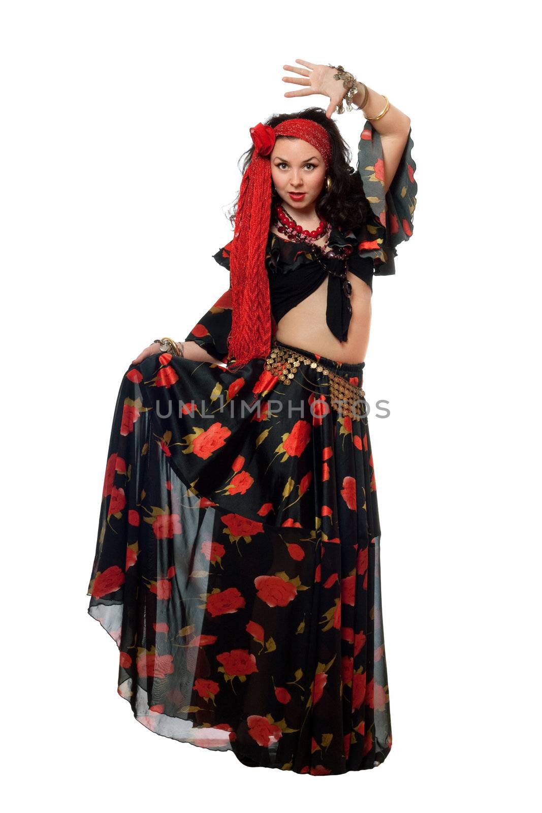 Dancing gypsy woman in a black skirt. Isolated
