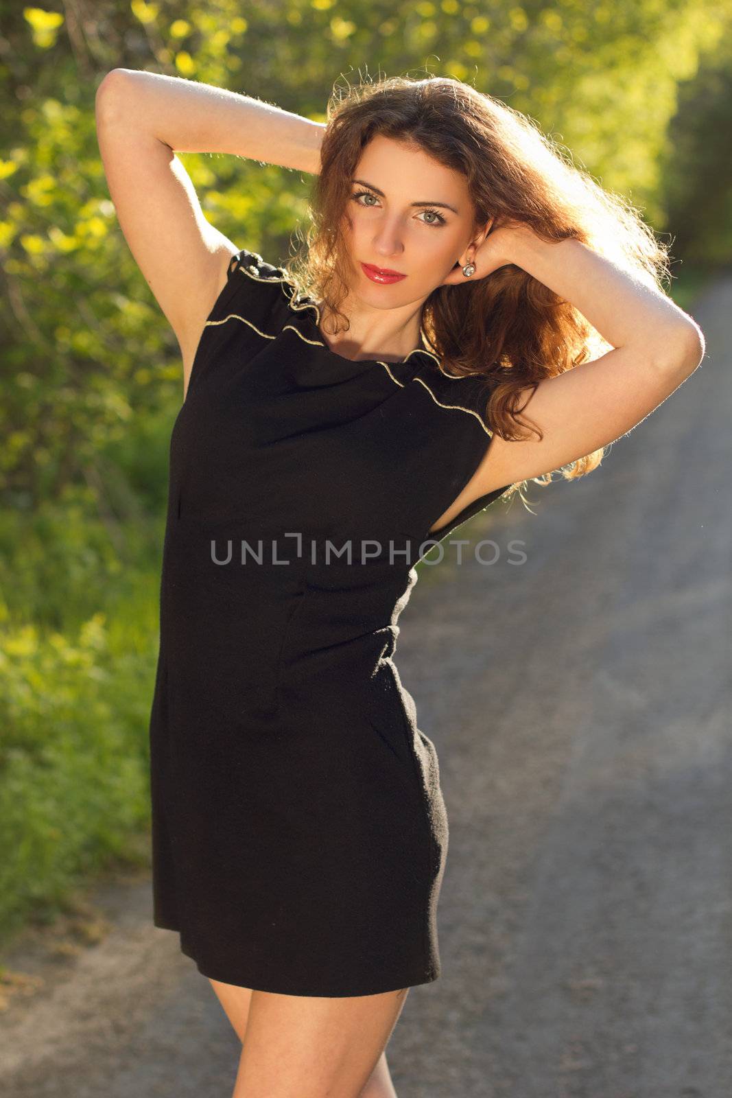 Portrait of a lovely young woman in black dress