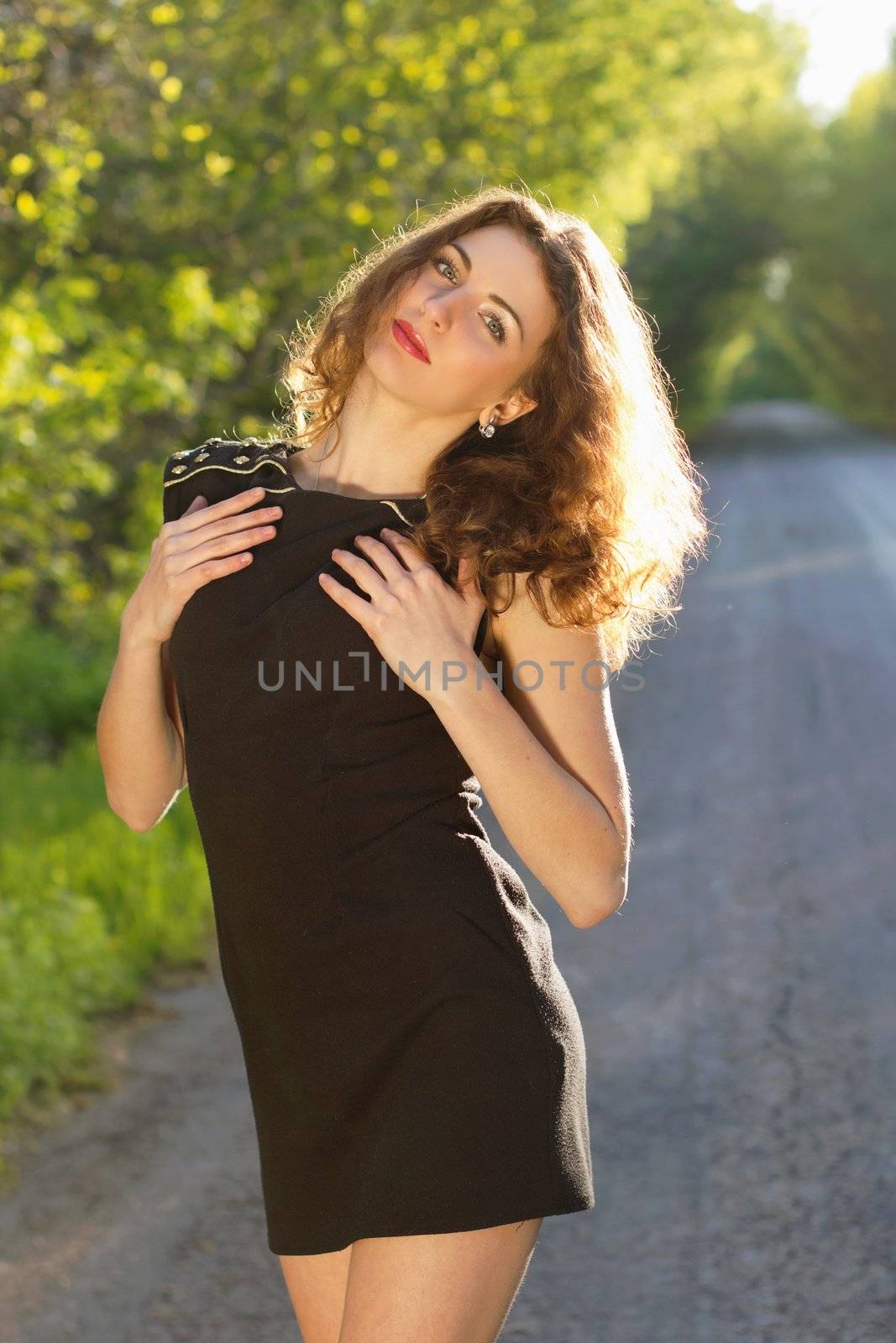 Portrait of a nice young woman in black dress