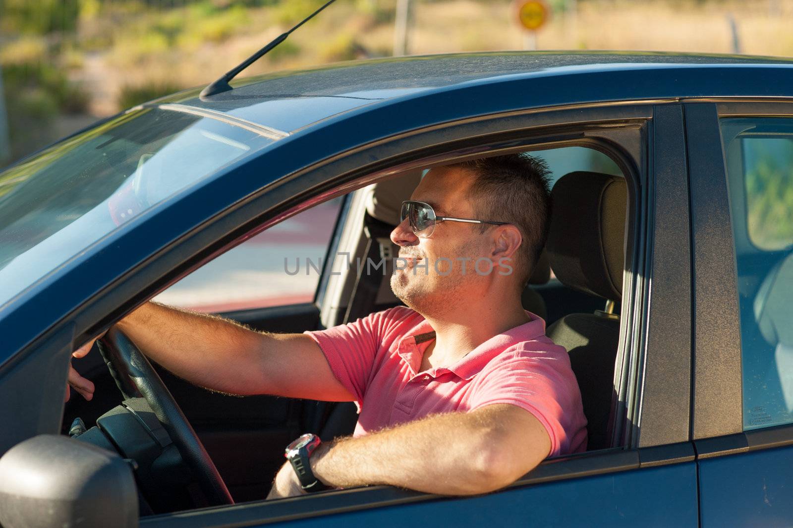 Male driver in an arrogant macho attitude