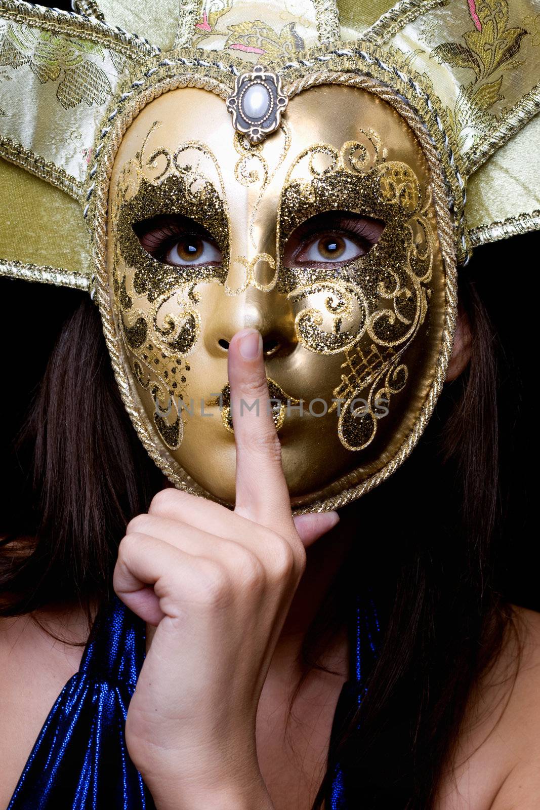 Young woman in a Venetian mask. Isolated