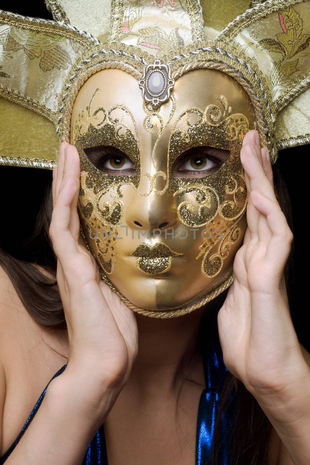Portrait of girl in a Venetian mask. Isolated
