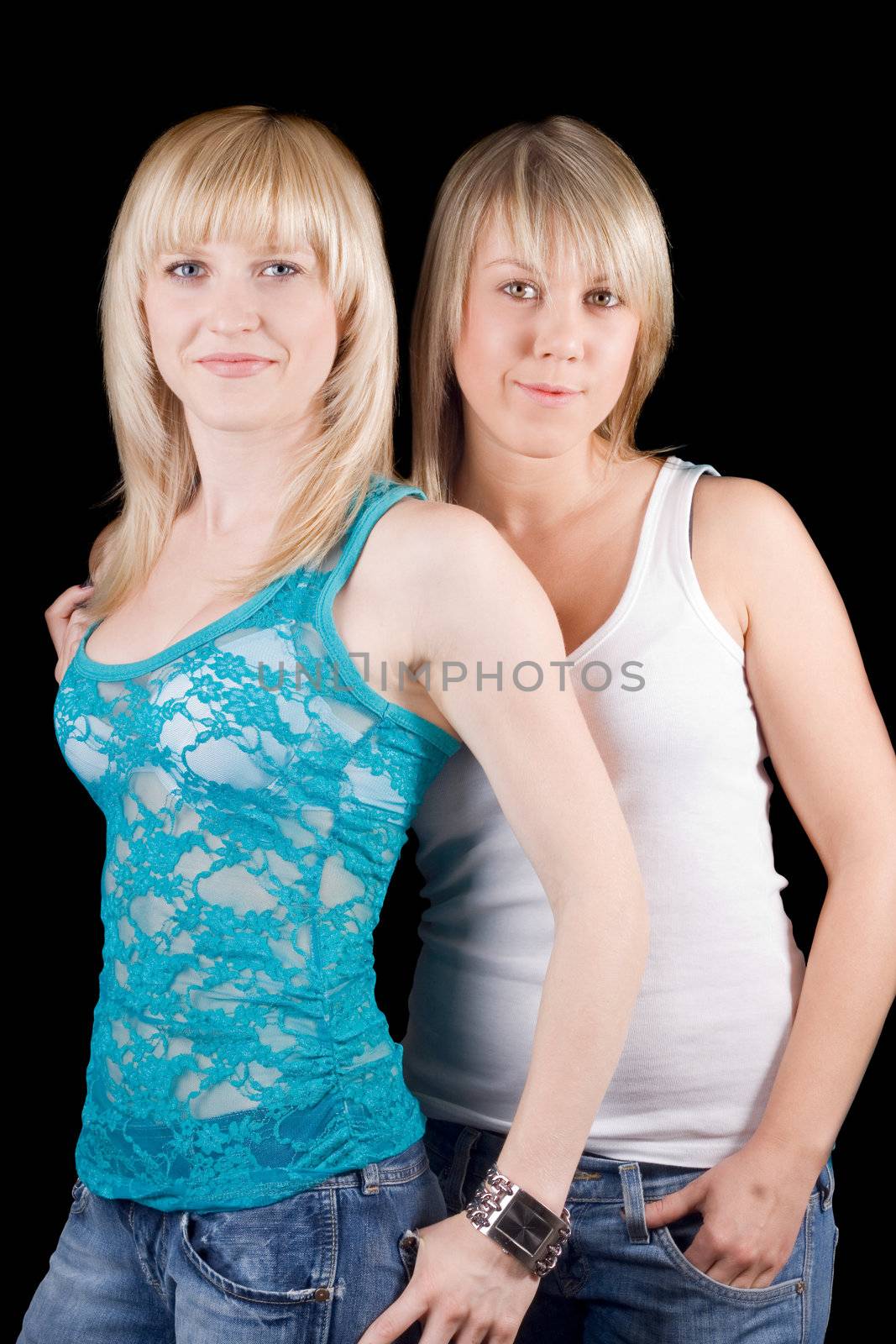 Portrait of the two young beauty blonde. Isolated