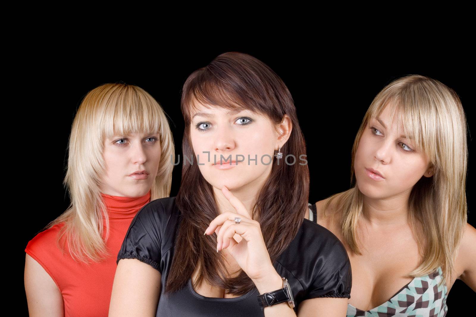 Portrait of the three beautiful young women. Isolated