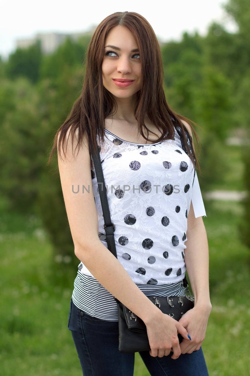 Portrait of a lovely young woman outdoors