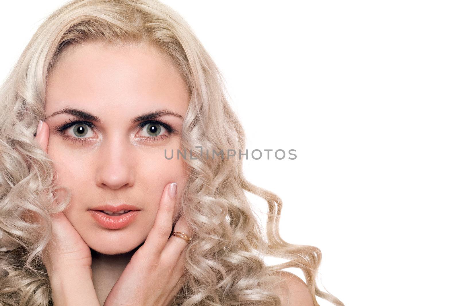 Closeup portrait of beautiful young blonde. Isolated