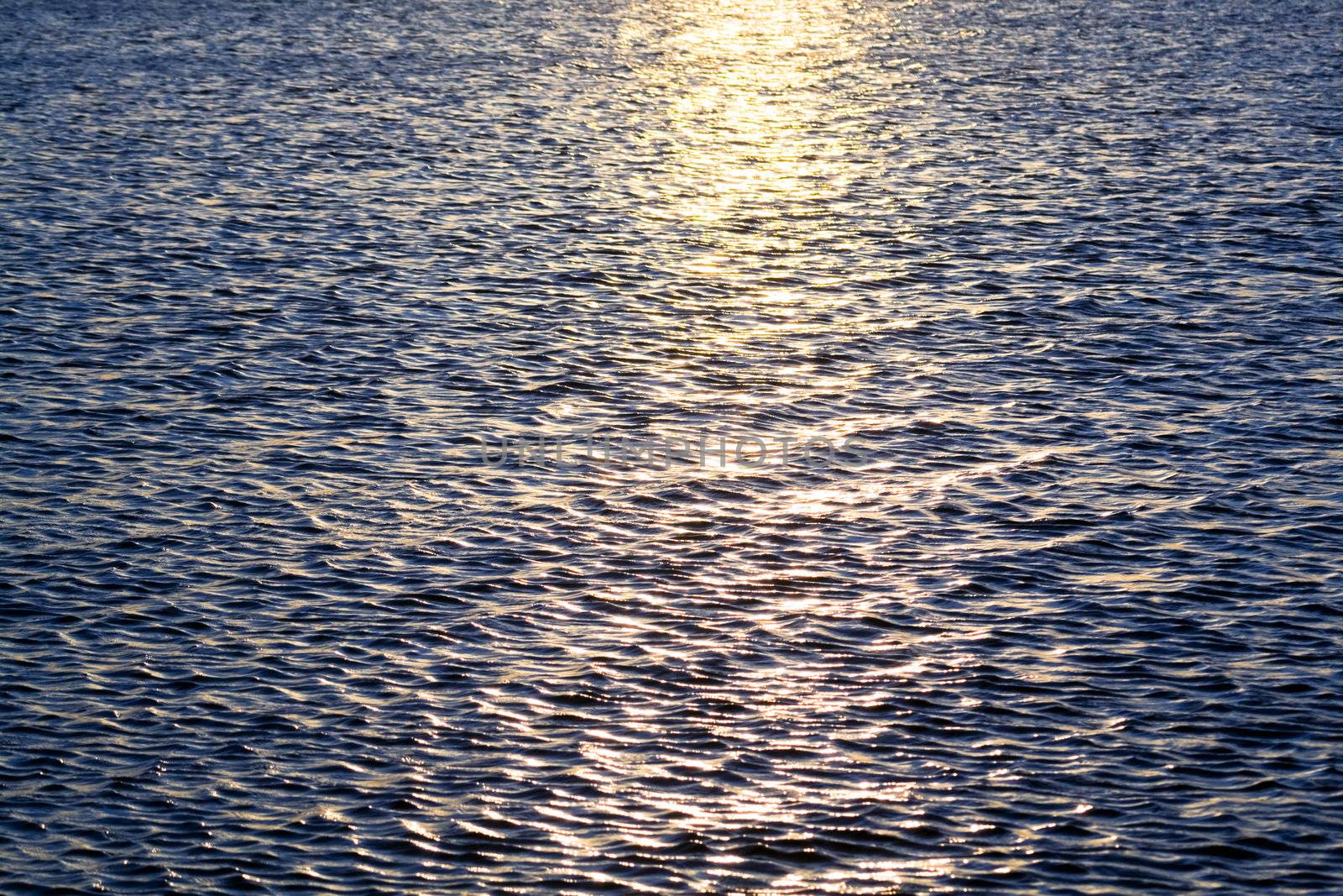 Sun reflexion in a dark blue sea surface