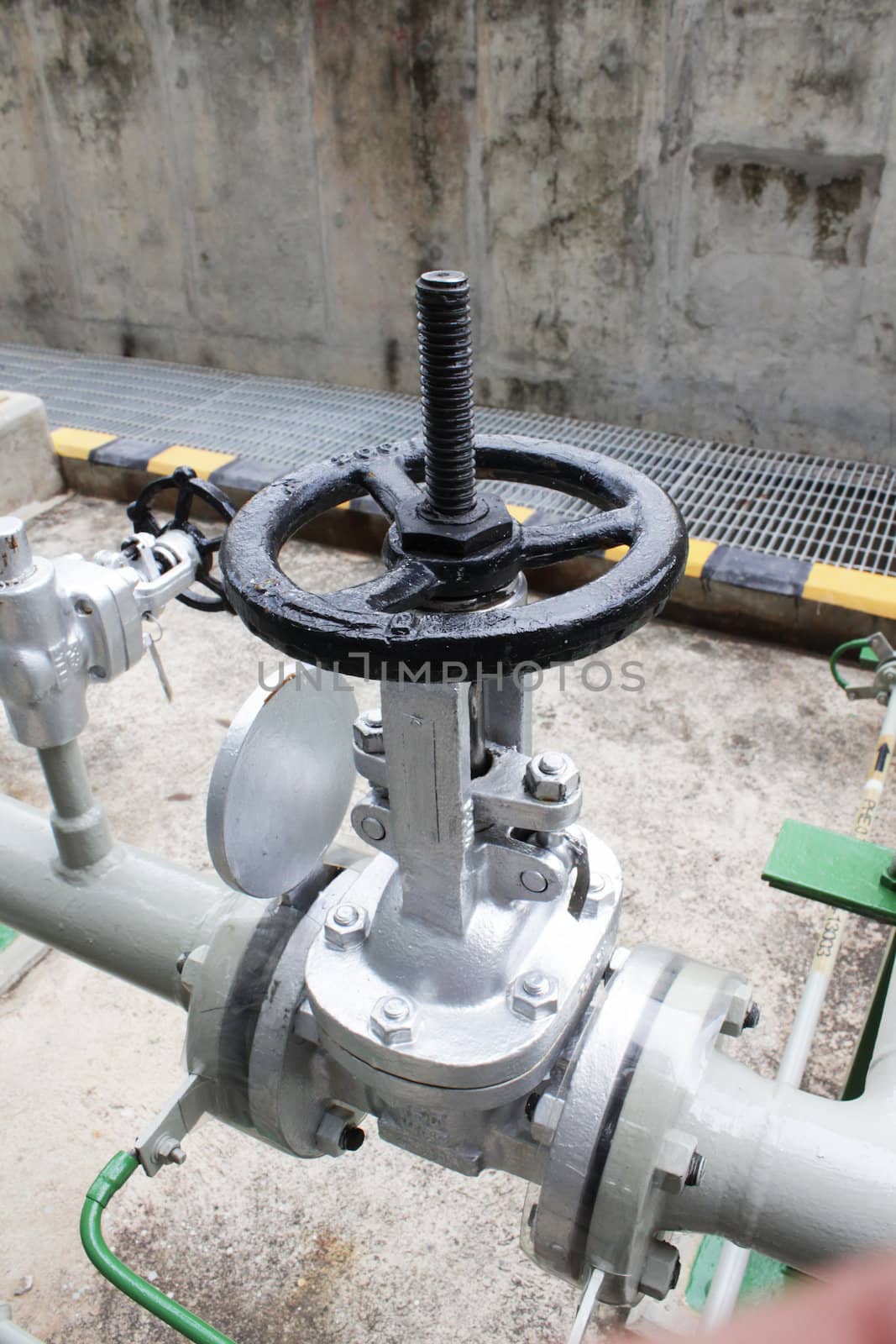 Handle valve with piping in chemical plant