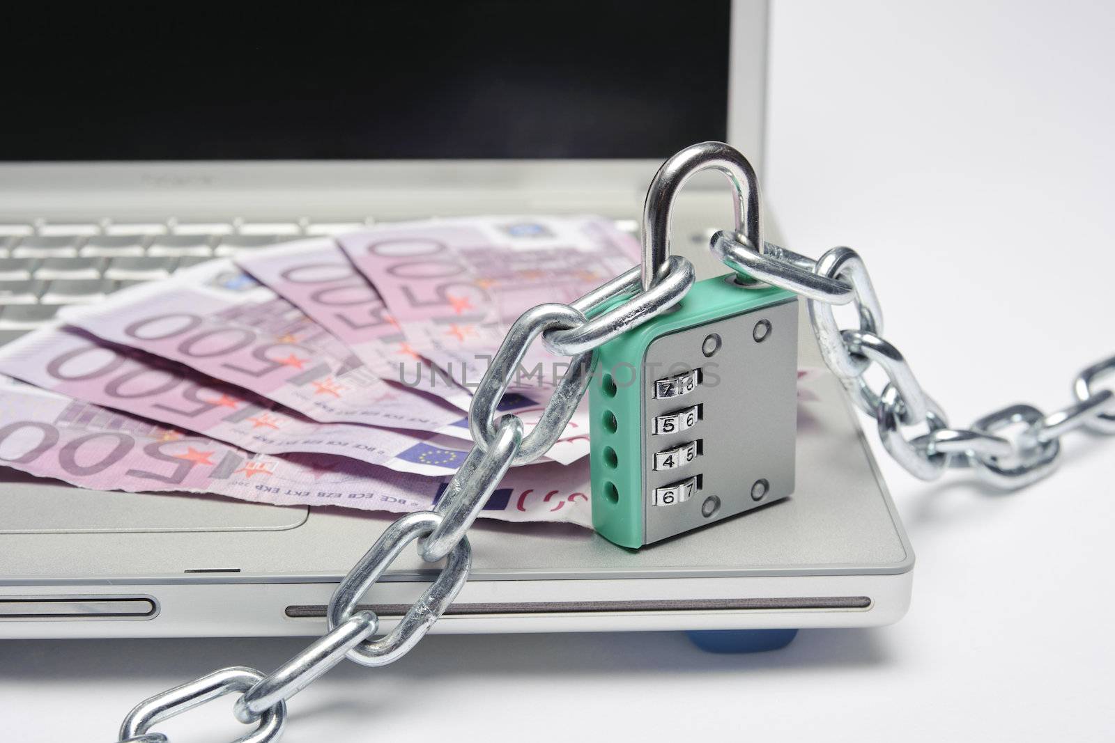 money padlock and laptop meaning  safety in bank transfers