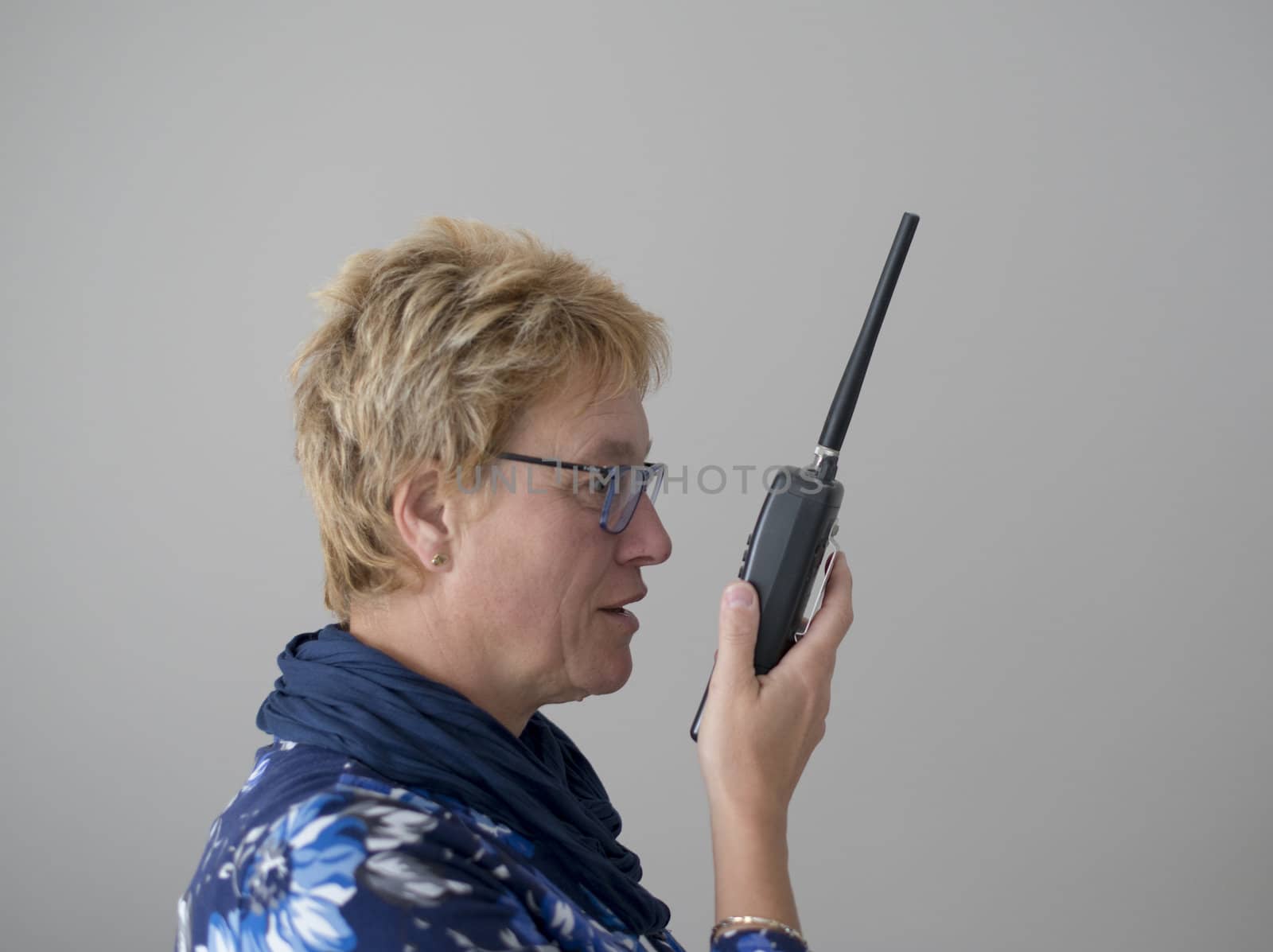 adult woman talking in radio by compuinfoto