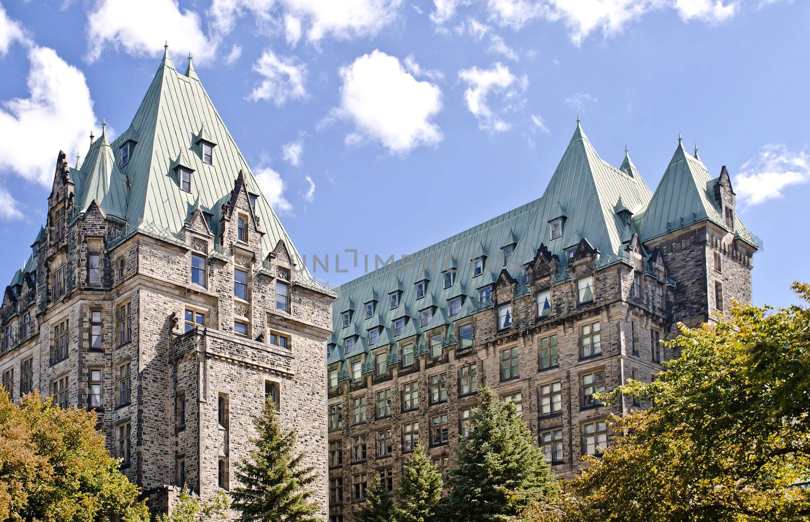 The Canadian Parliament Confederation Building seen from behind showing the 2 towers of offices for Members of Parliament in Ottawa, Canada.