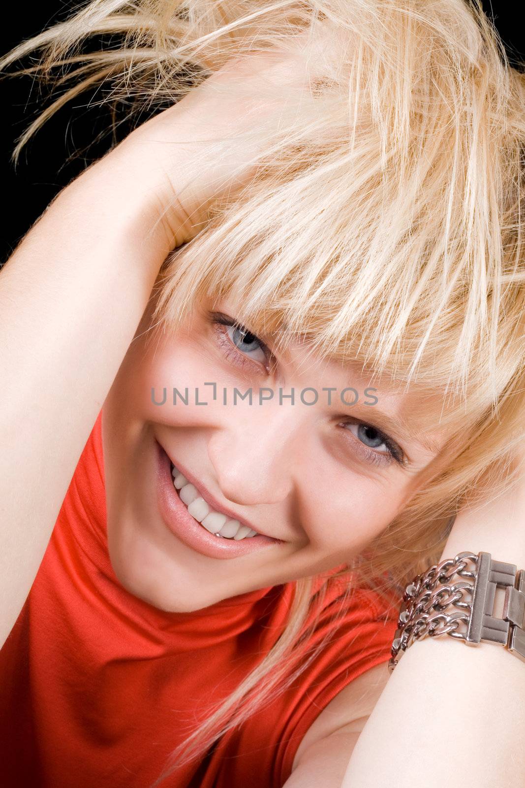 Portrait of the smiling young beauty blonde. Isolated
