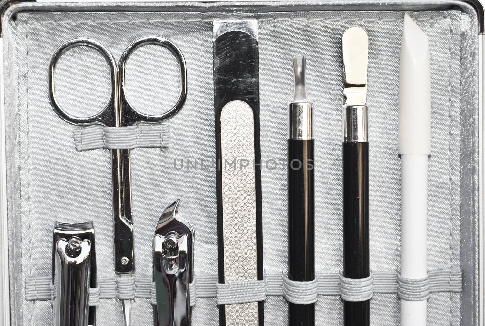 Tools of a manicure set in elegant container