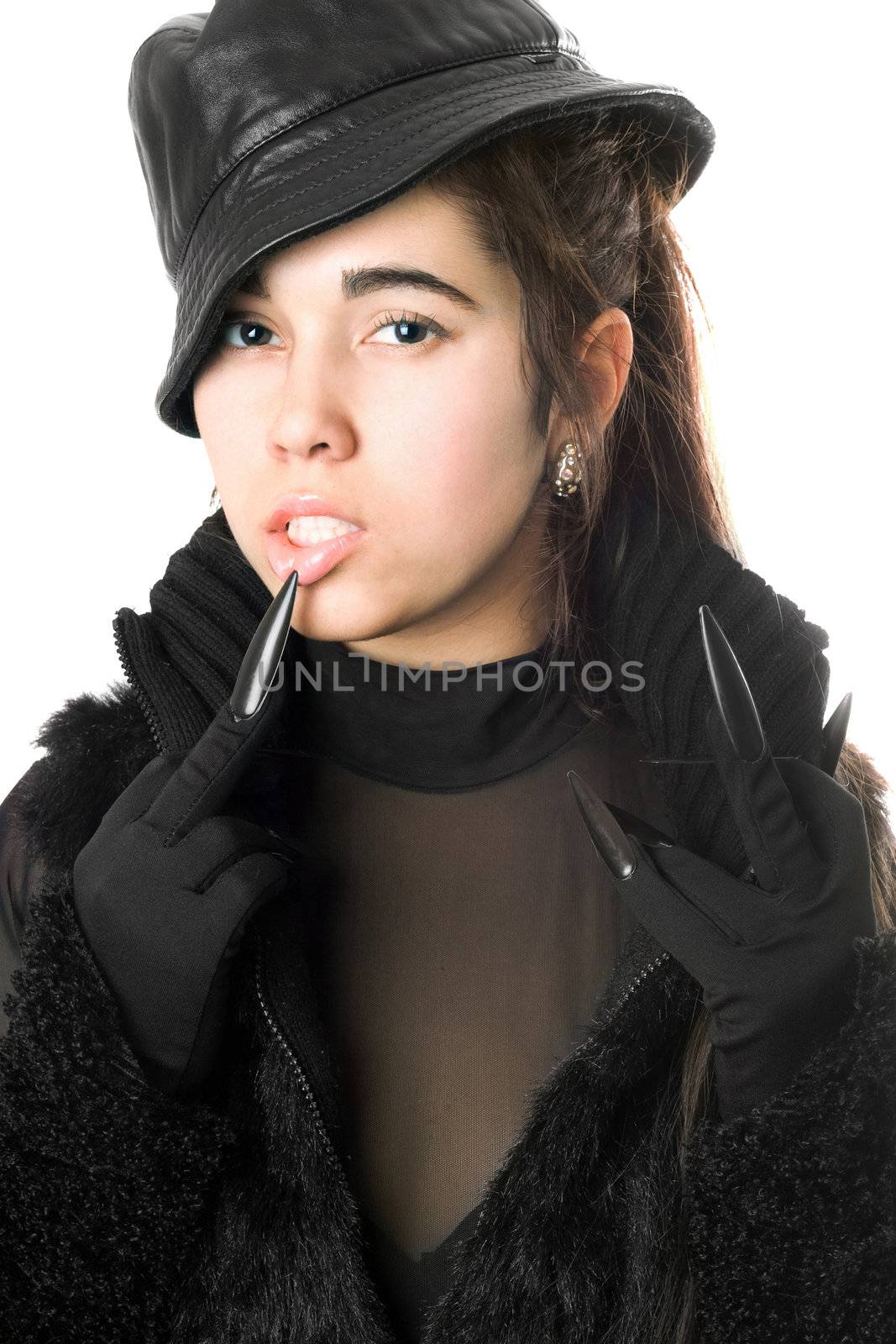 Portrait of pretty young brunette in gloves with claws. Isolated