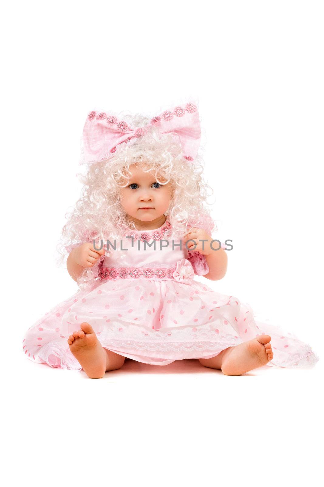 Beautiful baby girl in a pink dress