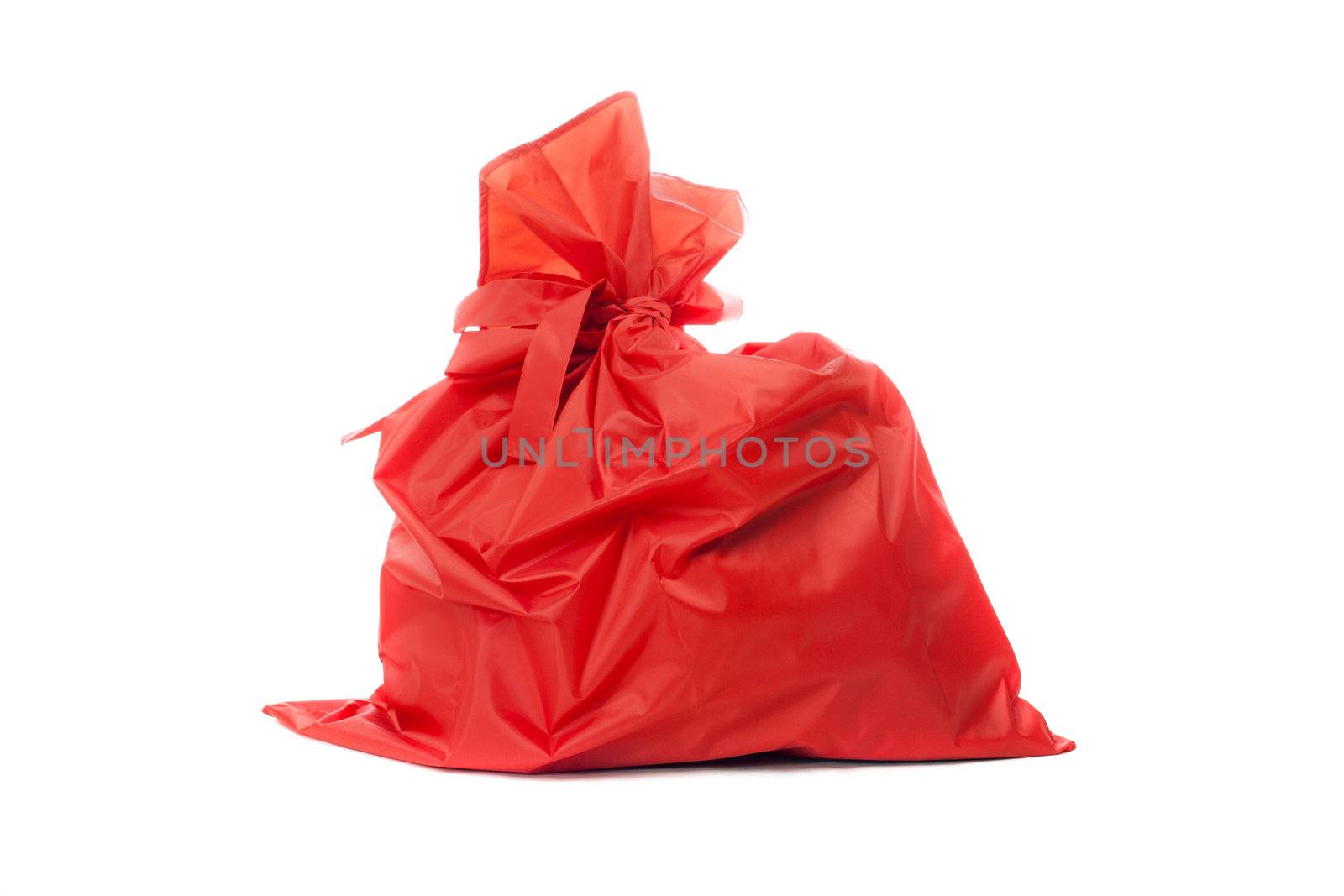 Red bag of Christmas gifts. Isolated on white