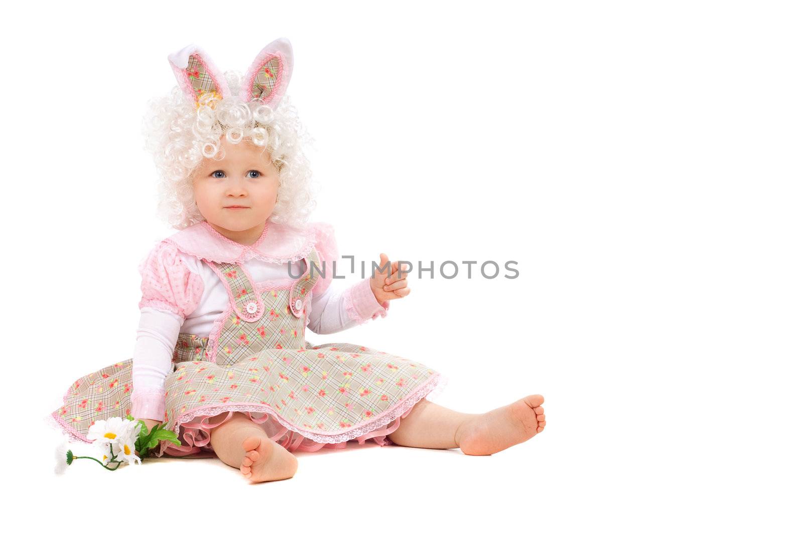 Baby girl with flowers in hand wearing a dress. Isolated