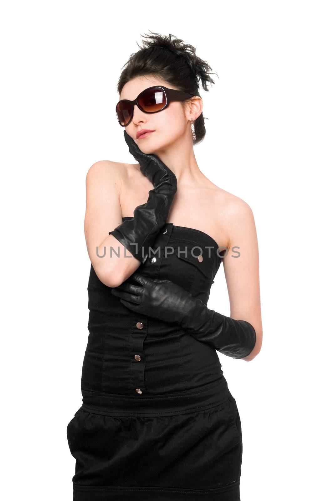 Portrait of pretty young woman in a black dress. Isolated