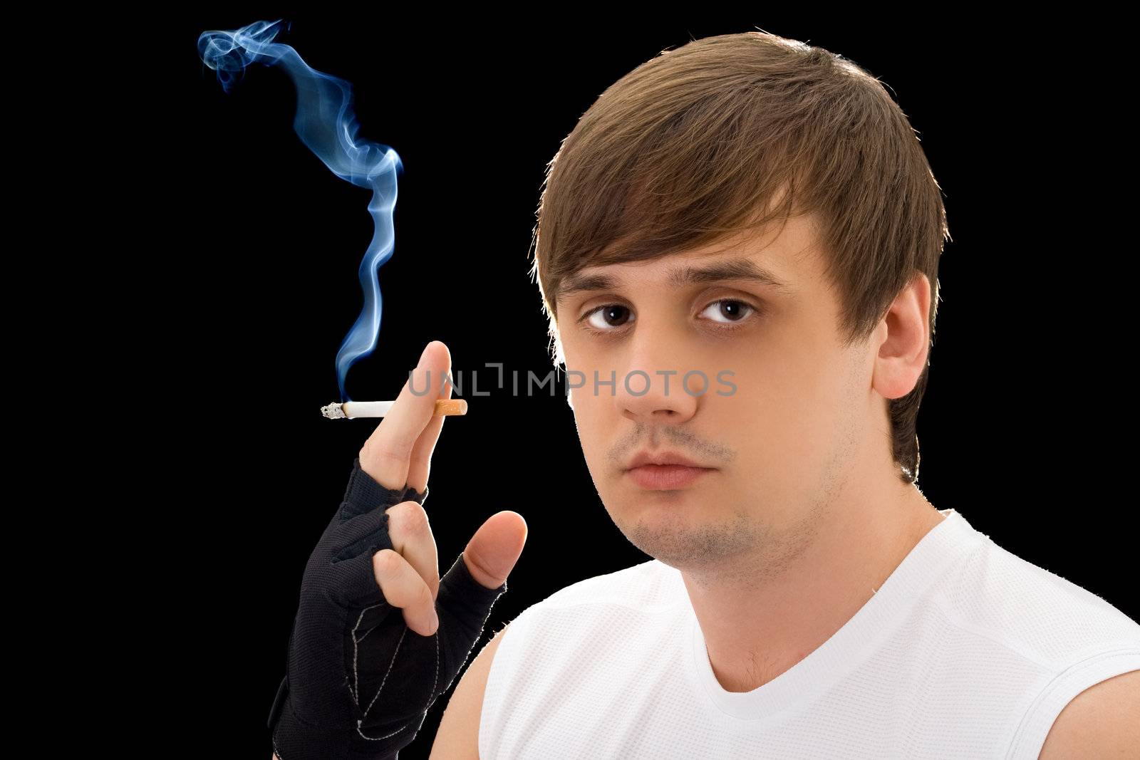 Portrait of the young man with a cigarette. Isolated