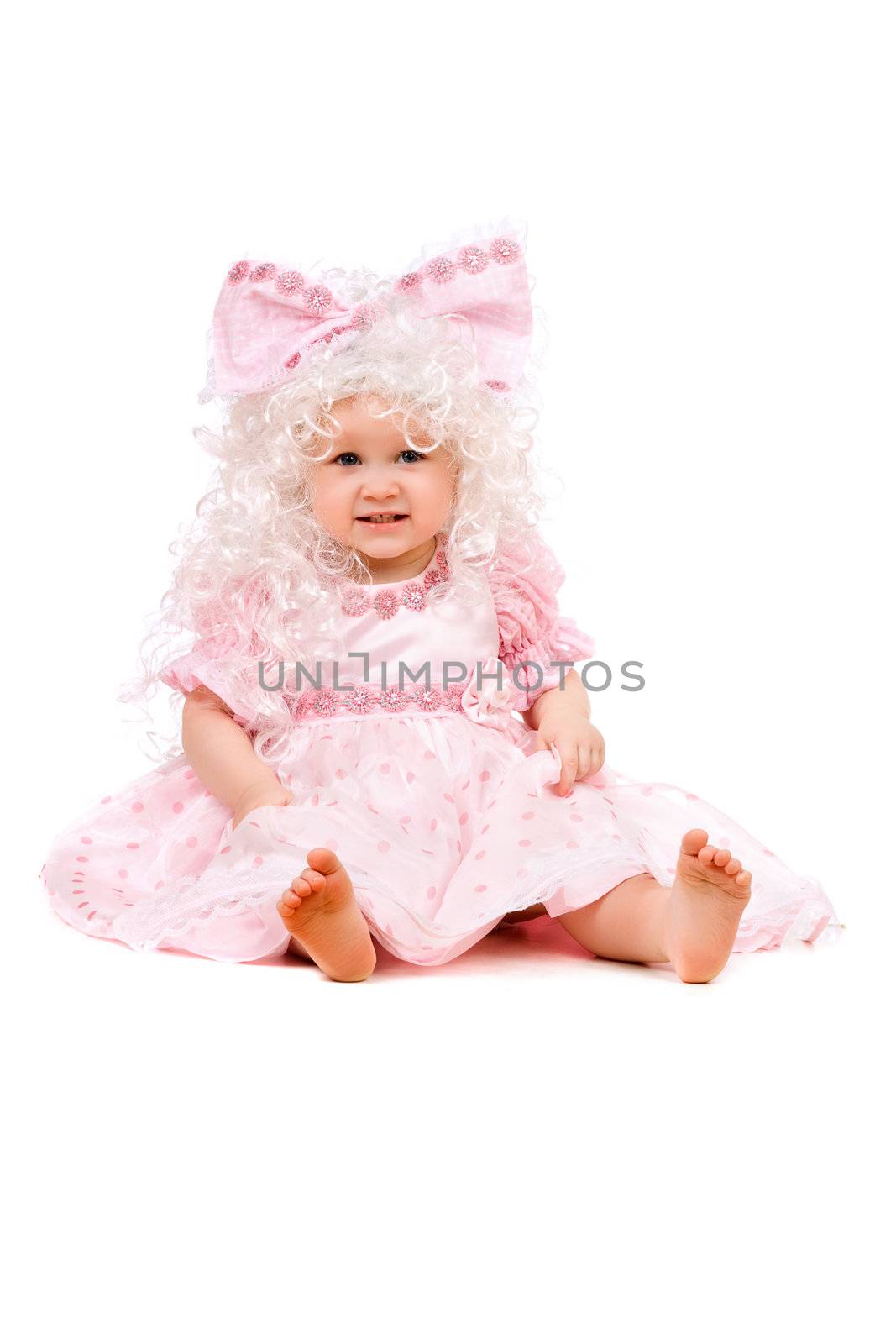 Funny baby girl in a pink dress