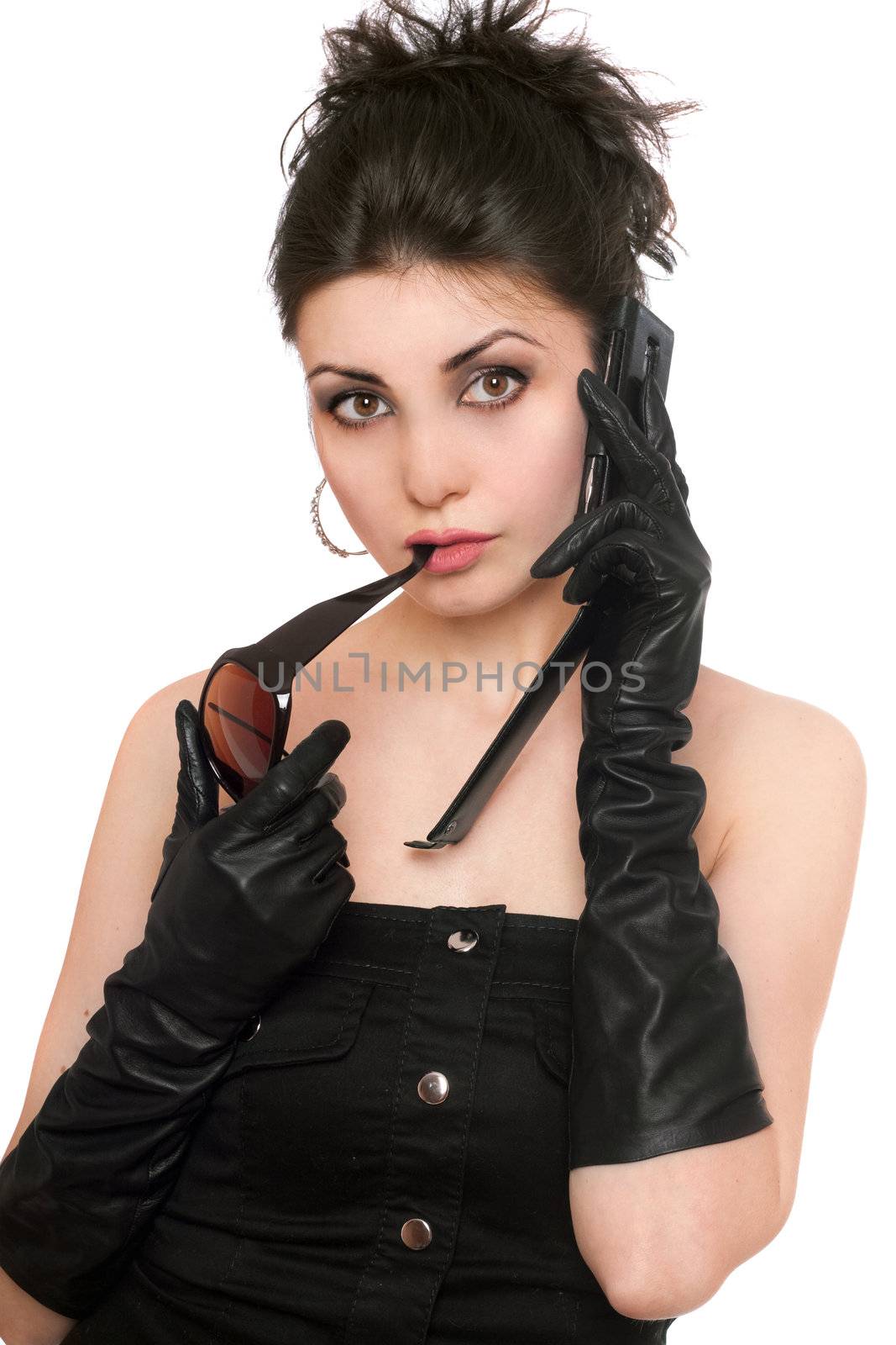 Portrait of beautiful brunette talking on the phone. Isolated