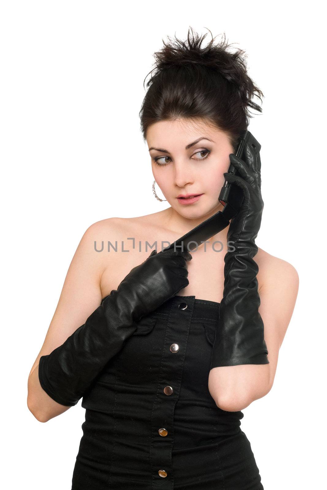Portrait of pensive brunette talking on the phone. Isolated