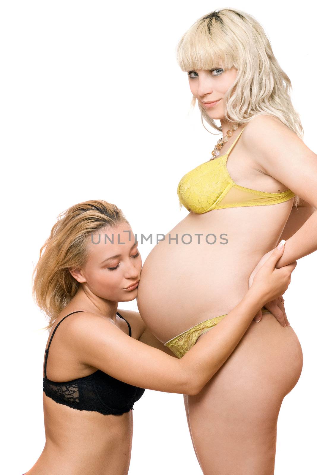 Pregnant blond woman with the girlfriend. Isolated