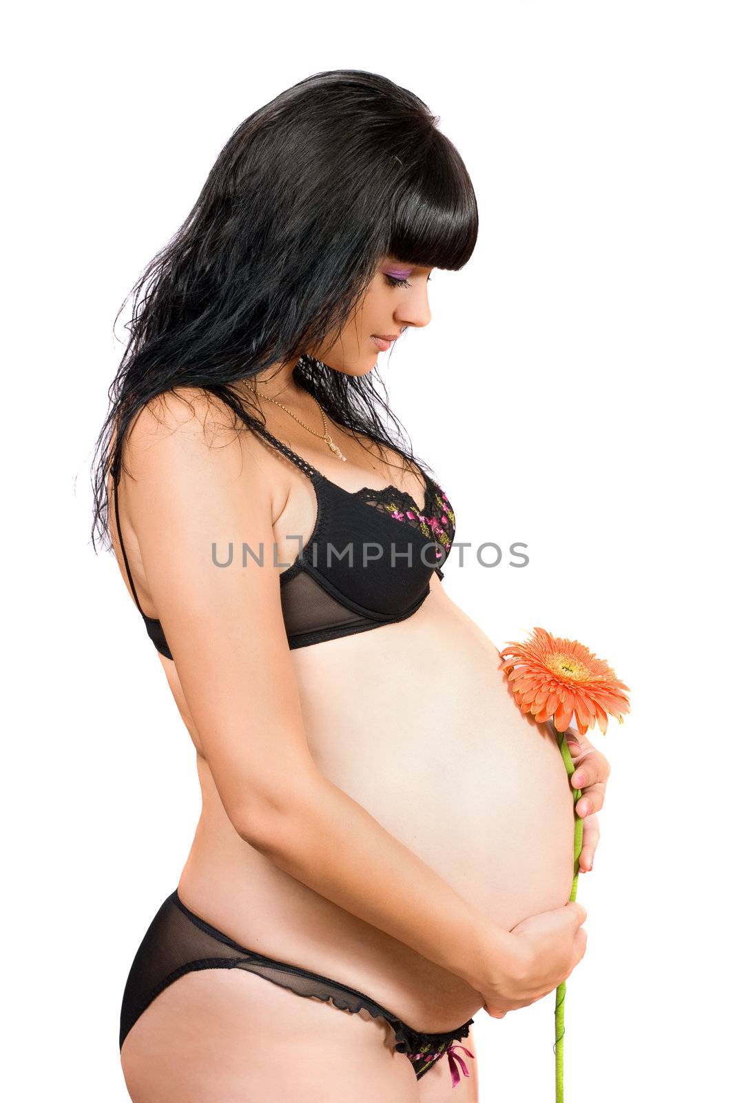 Portrait of a pregnant young woman. Isolated