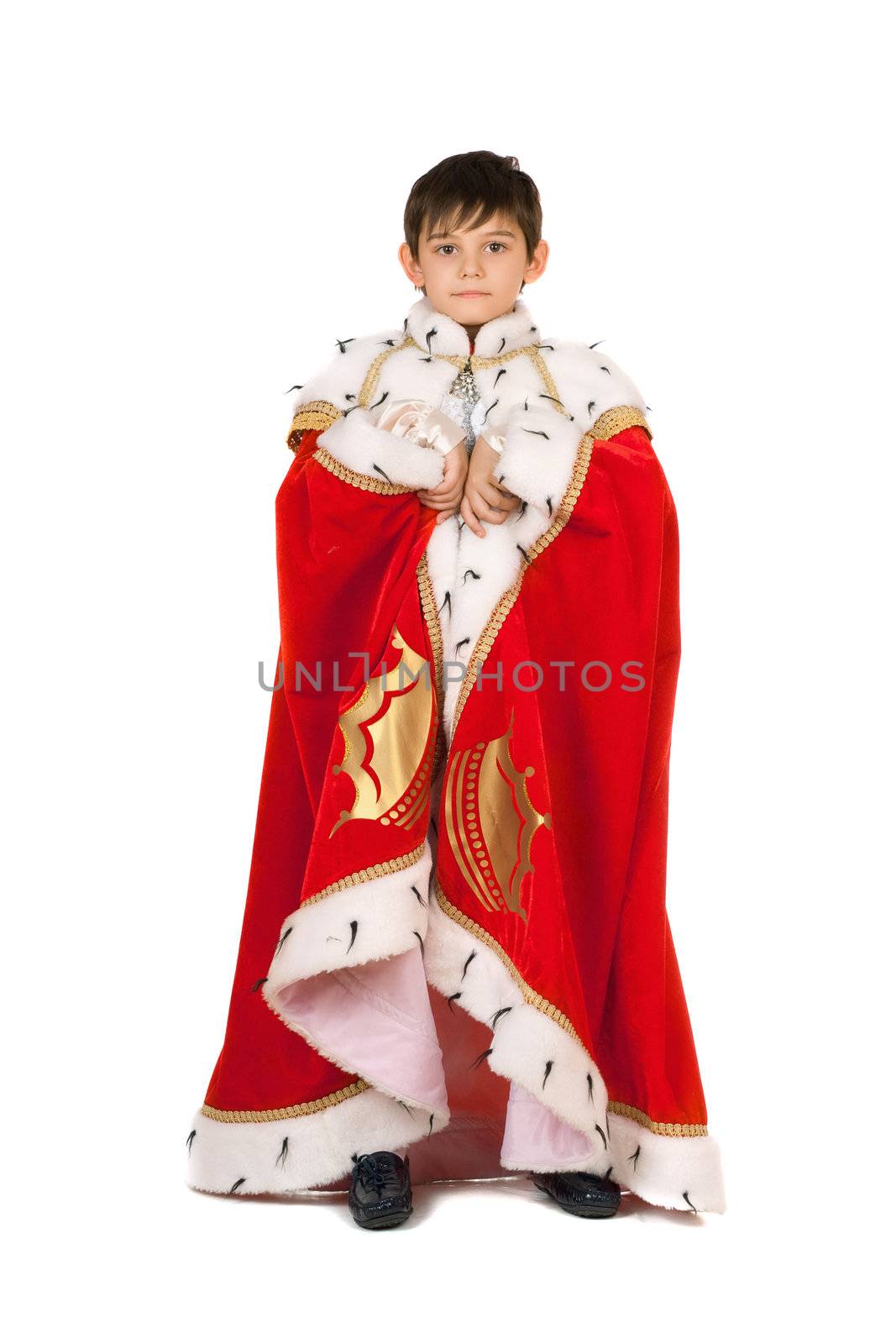 Boy dressed in a robe of King. Isolated on white