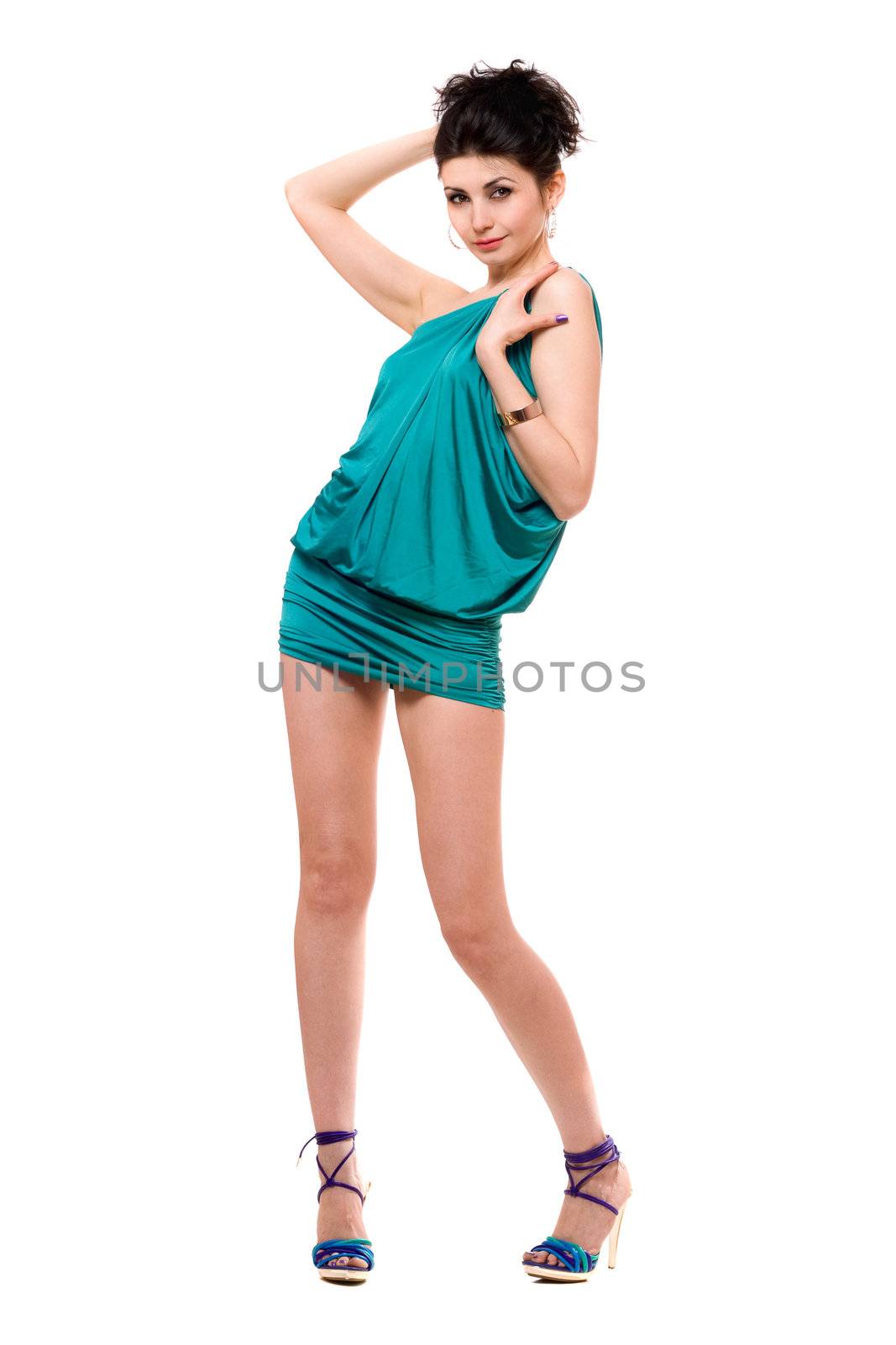 Playful young woman in a blue dress. Isolated