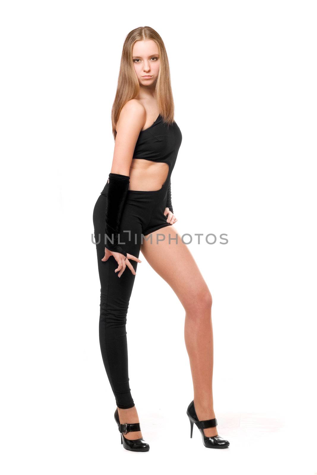 Attractive young woman in skintight black costume. Isolated