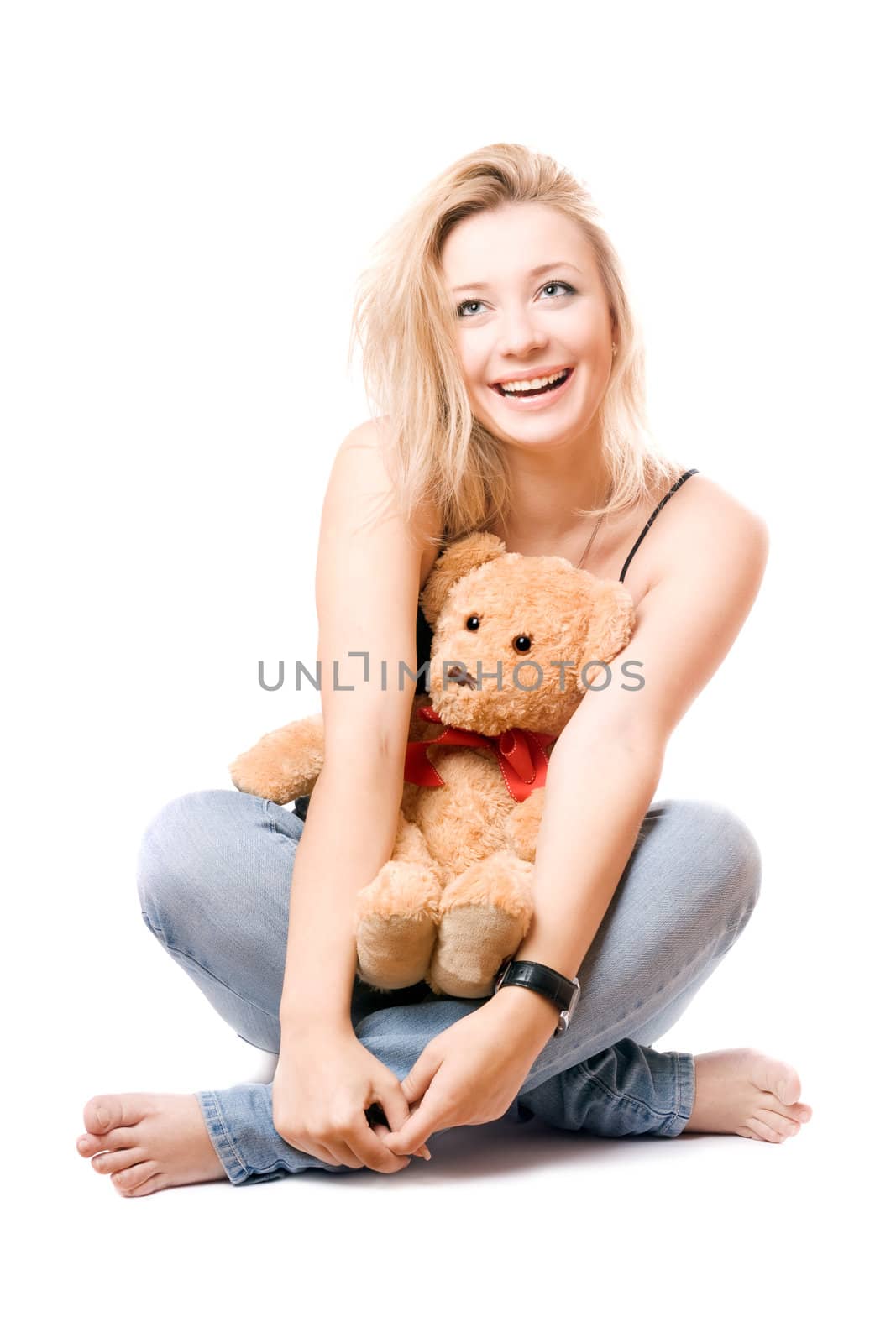 Cheerful blonde with a teddy bear. Isolated