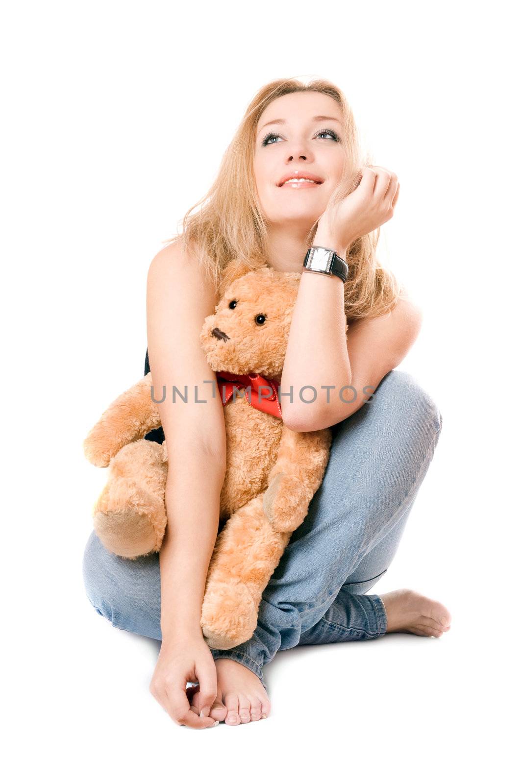 Pretty dreamy blonde with a teddy bear. Isolated