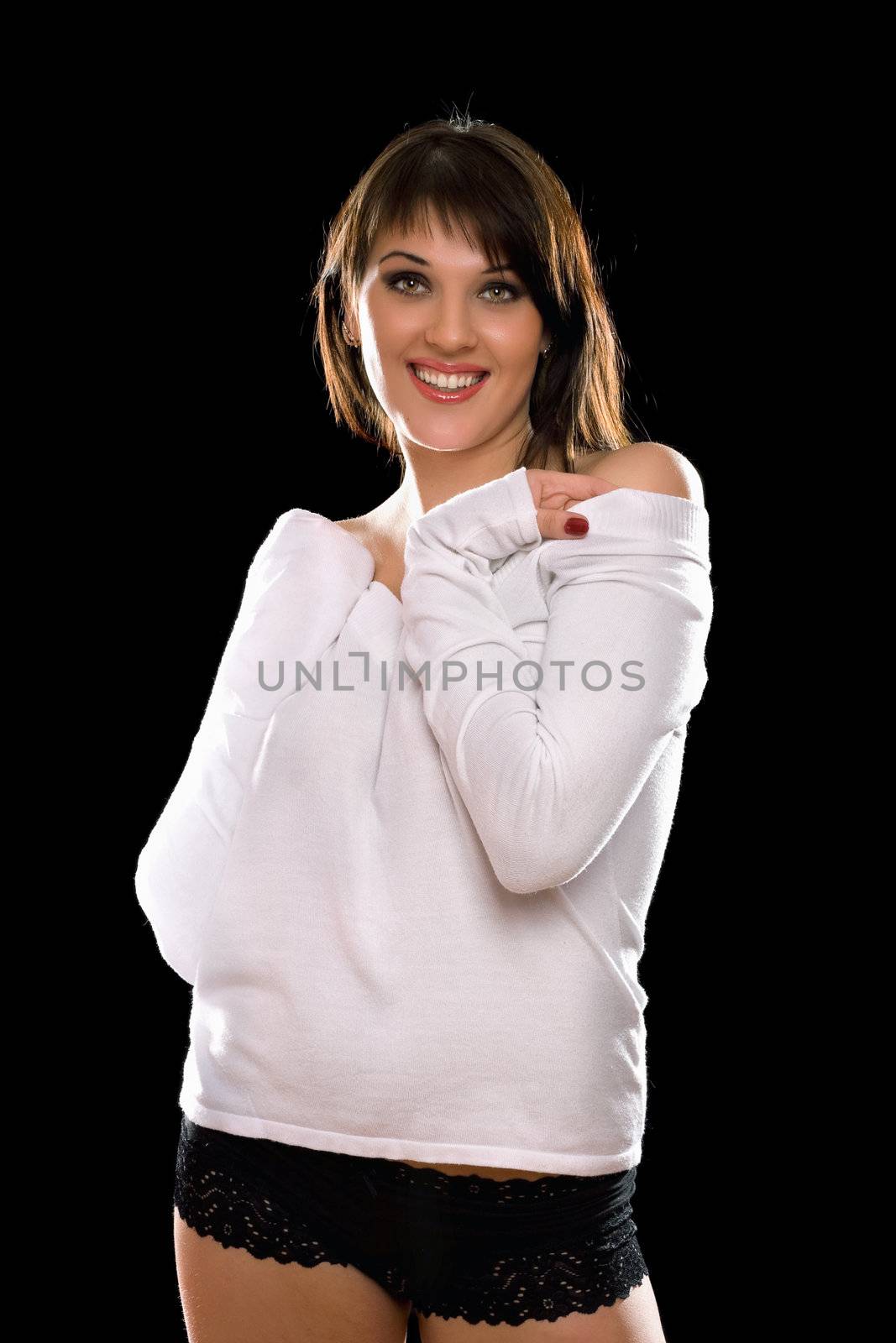 Portrait of a pretty young brunette. Isolated on black
