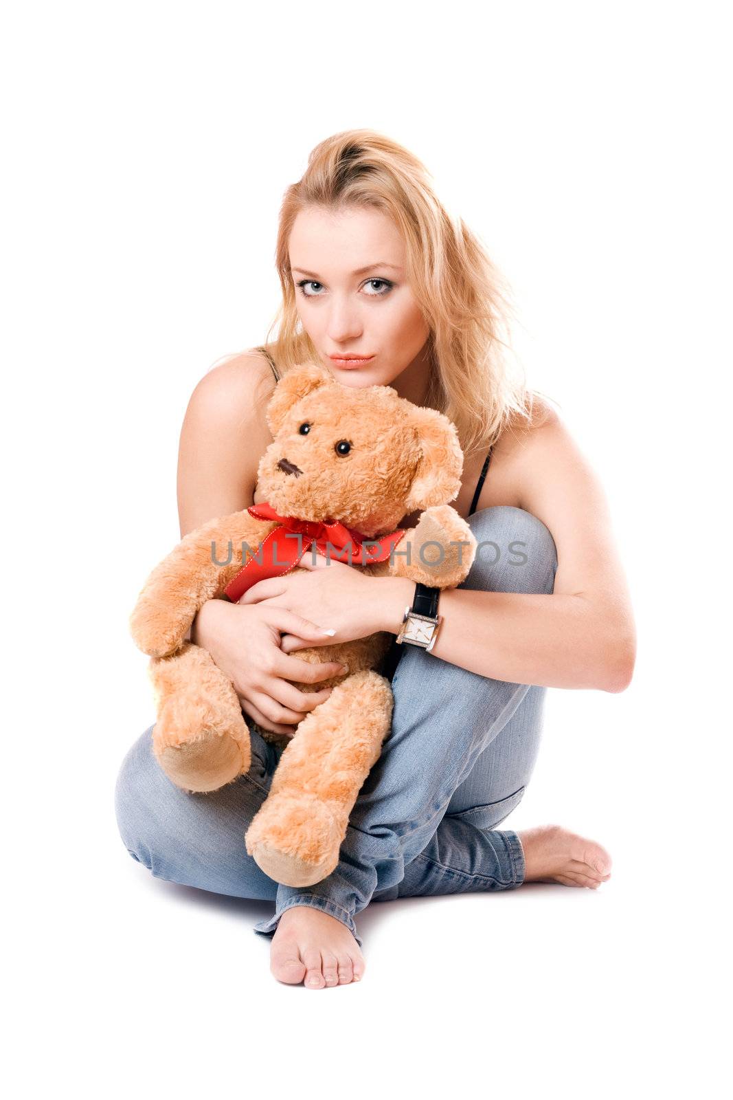 Beautiful blonde with a teddy bear. Isolated