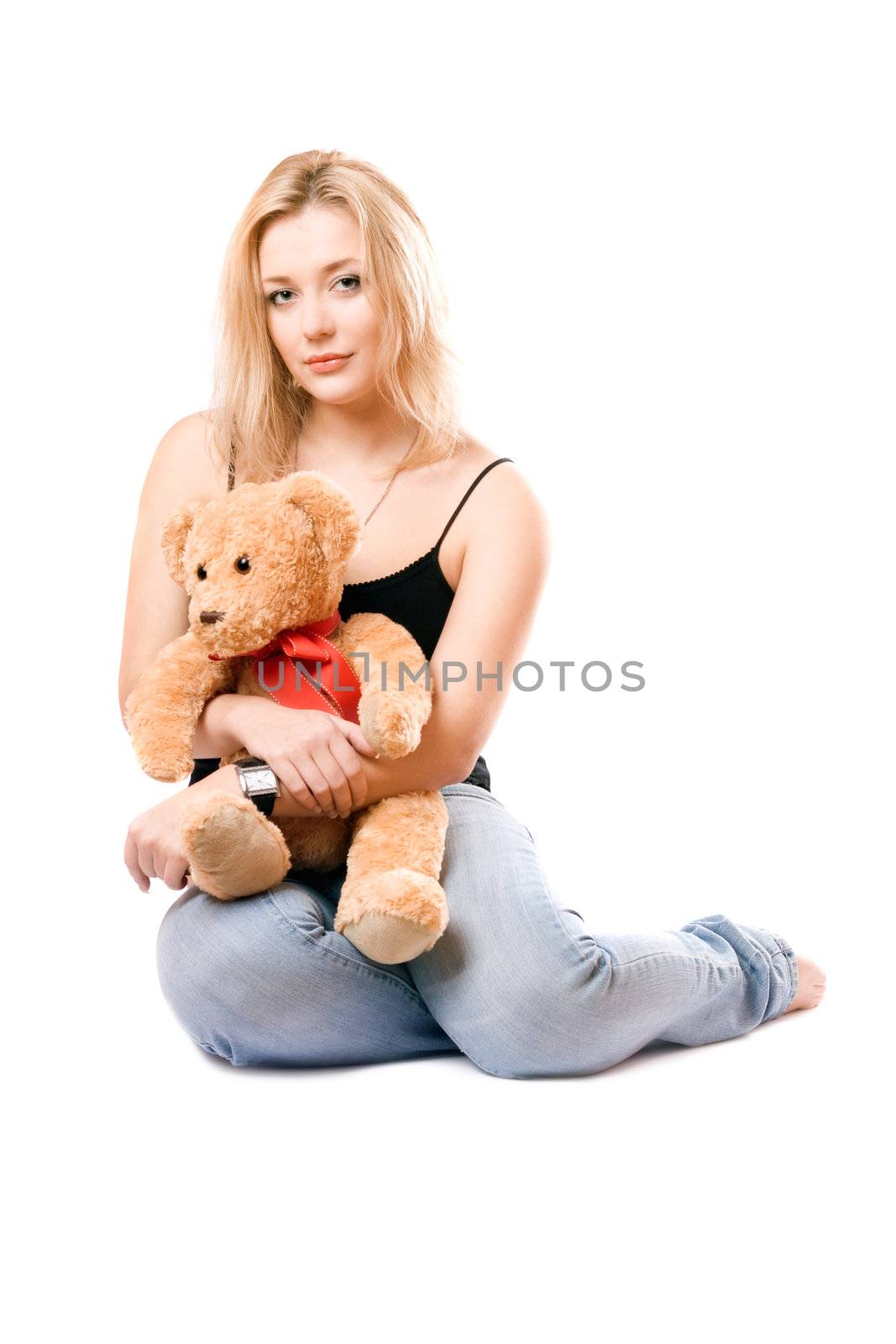 Lovely blonde with a teddy bear. Isolated