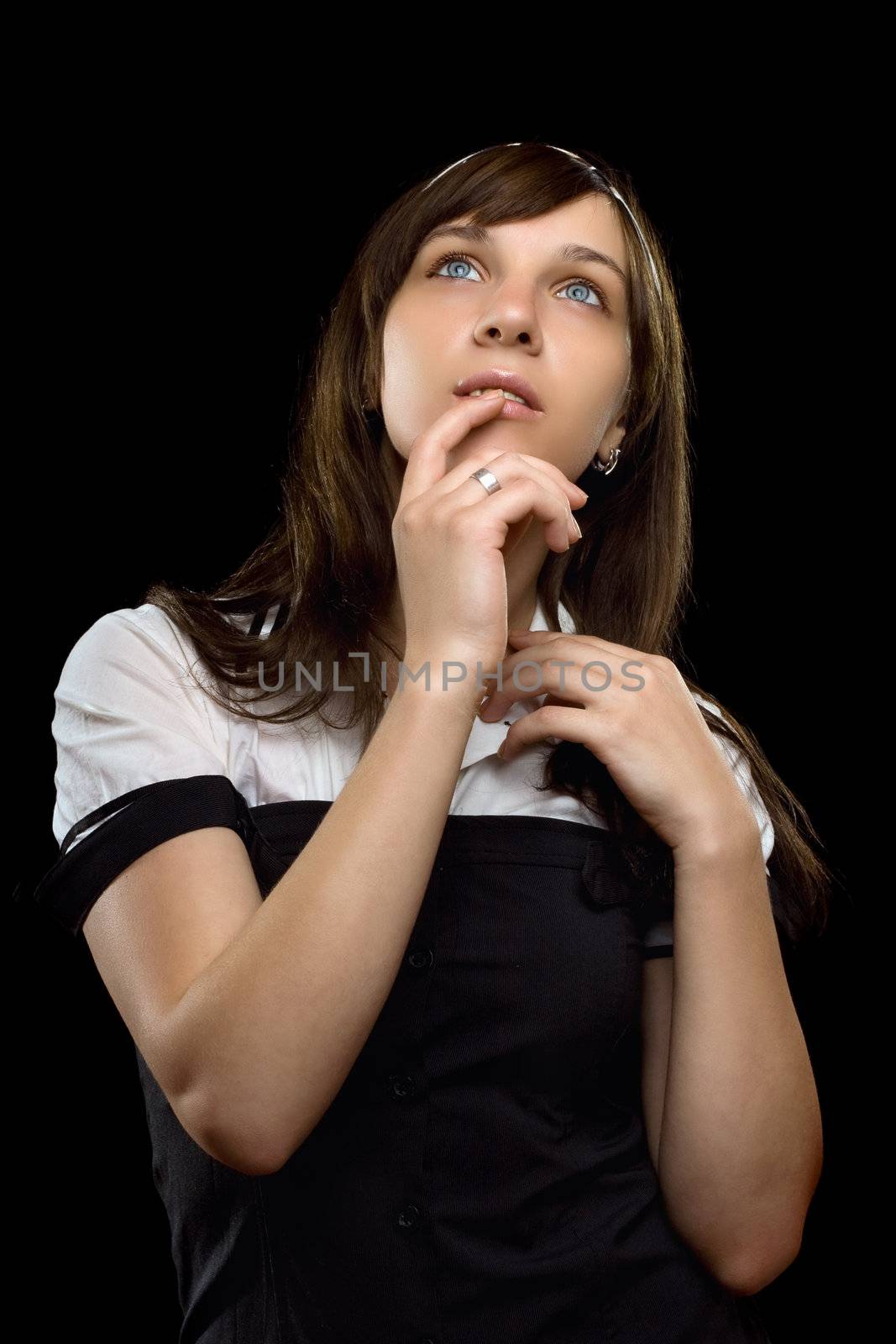 Portrait of a dreamy young woman. Isolated