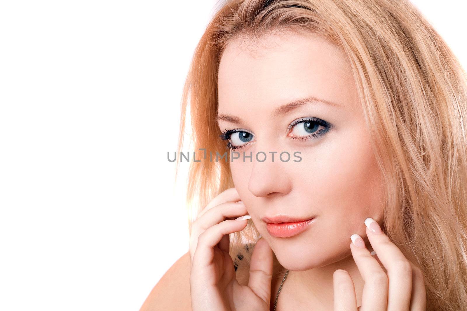 Closeup portrait of a lovely young blonde. Isolated