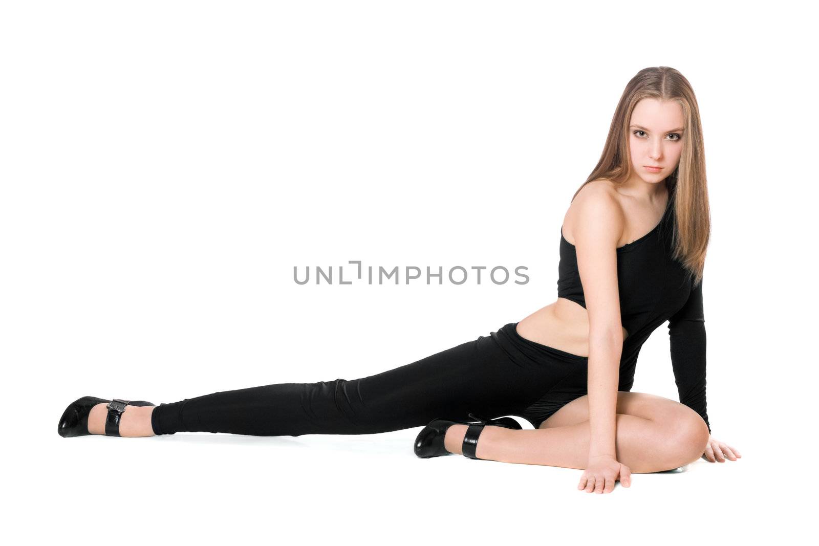 Sexy young woman sitting in a black tight-fitting body suit dance