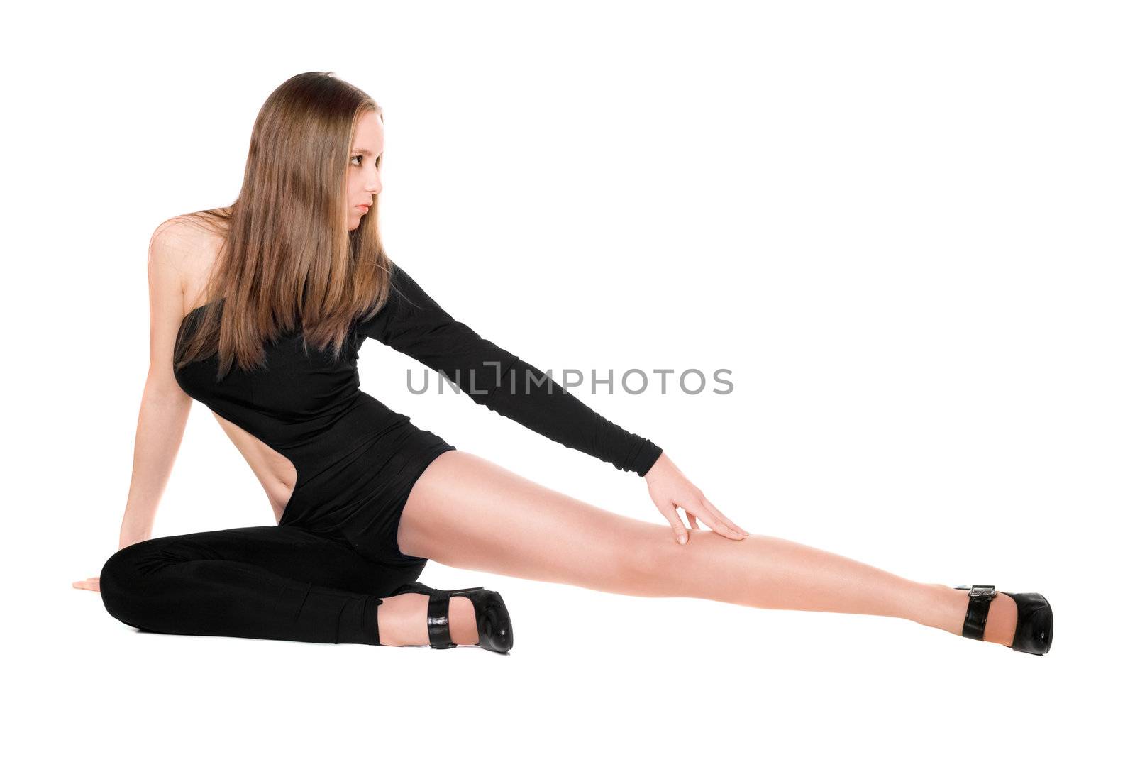 Leggy young woman sitting in a black tight-fitting body suit dance