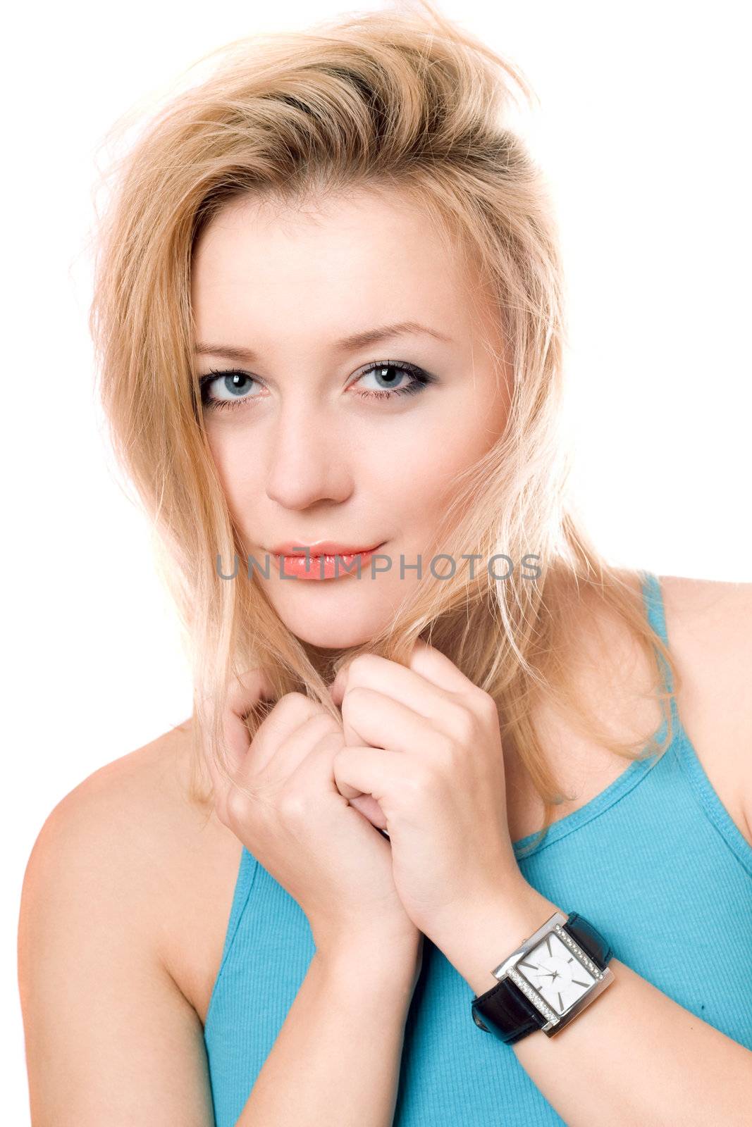 Closeup portrait of pretty young blonde. Isolated