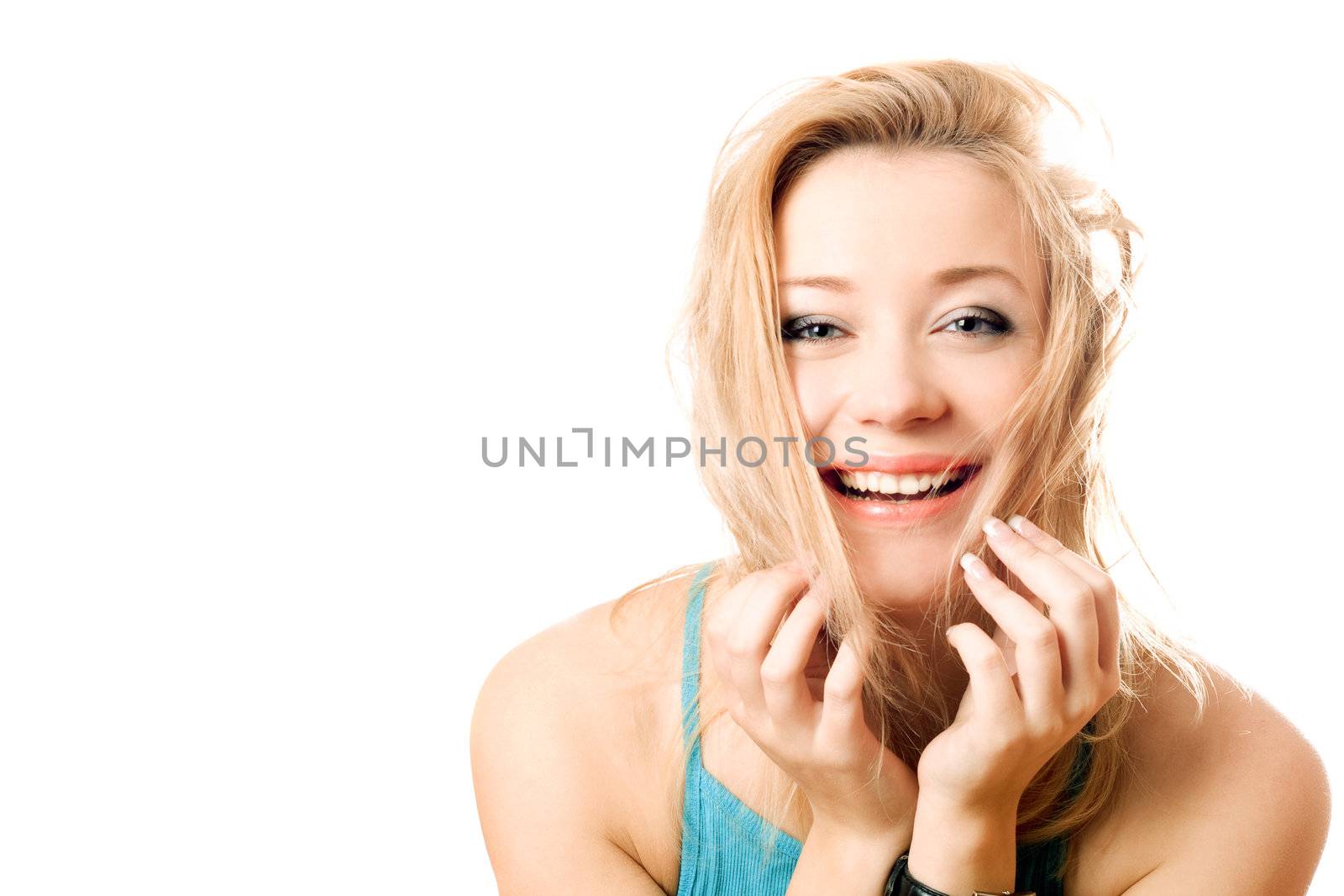 Portrait of a joyful attractive blonde. Isolated on white