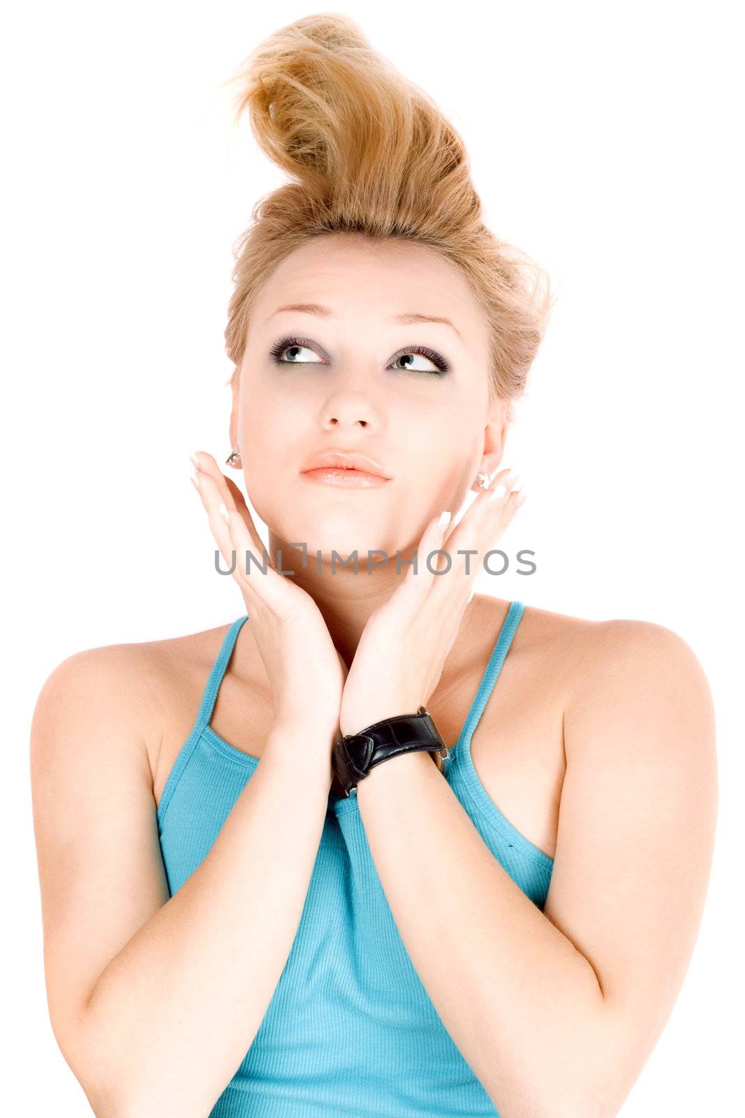Portrait of pretty blond girl lying on a white